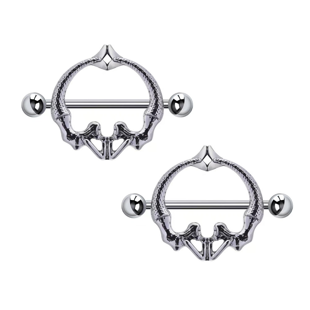 A pair of anatomical skeletal pelvis nipple shields for alternative body piercing fashion.