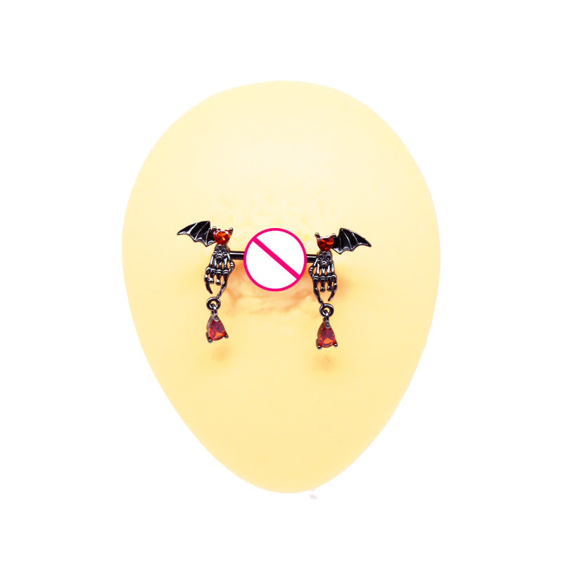 Single bat wing nipple barbell with dangling red drops on a yellow display model with a central censor symbol.