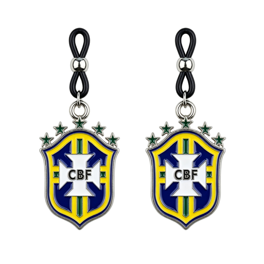 A matching pair of adjustable faux body jewelry nipple rings with dangling Brazil football club shields, showcasing the sporty soccer core fashion trend.