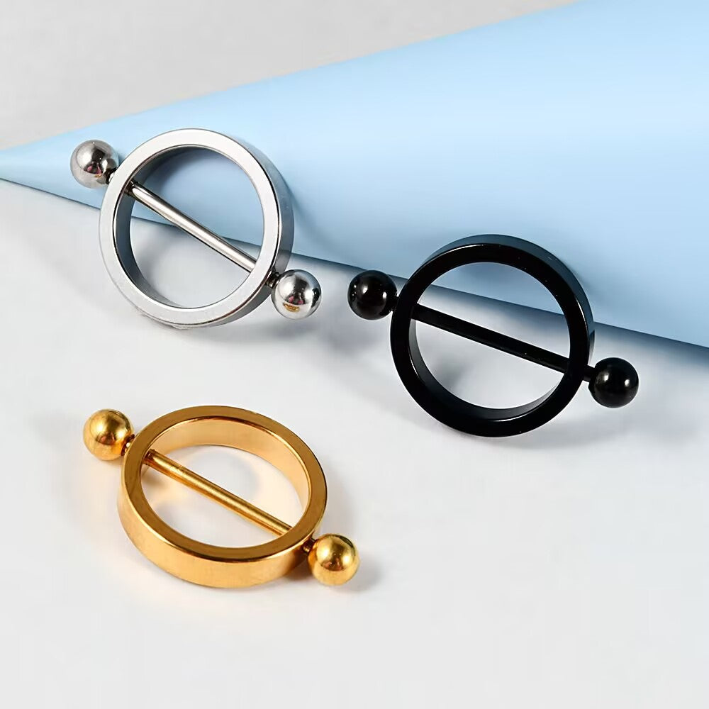 A collection of silver, gold, and black minimalist circle nipple shields.