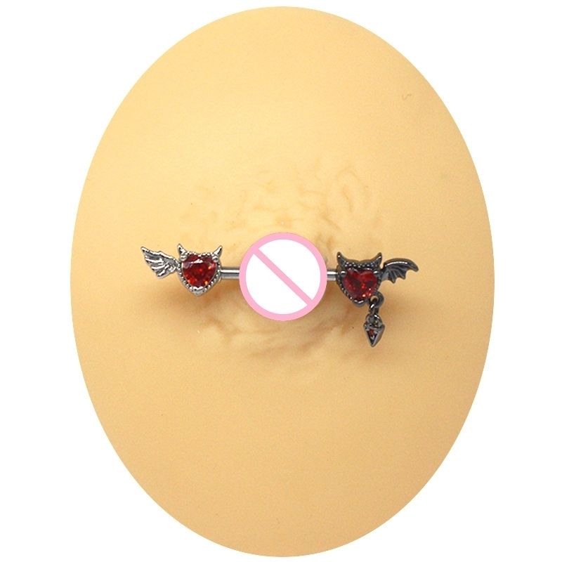 Professional demonstration of the devil heart nipple barbell placement on a silicone piercing model.