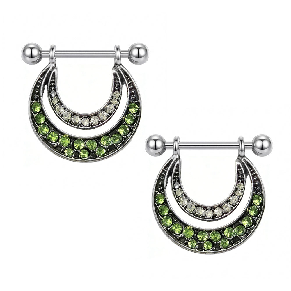 Two pieces of double-layered nipple shields with green gemstones, perfect for gothic and industrial style body jewelry collections.