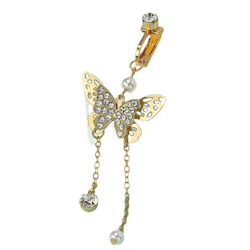 Clip on clamp mechanism of non piercing butterfly belly ring isolated on plain white background