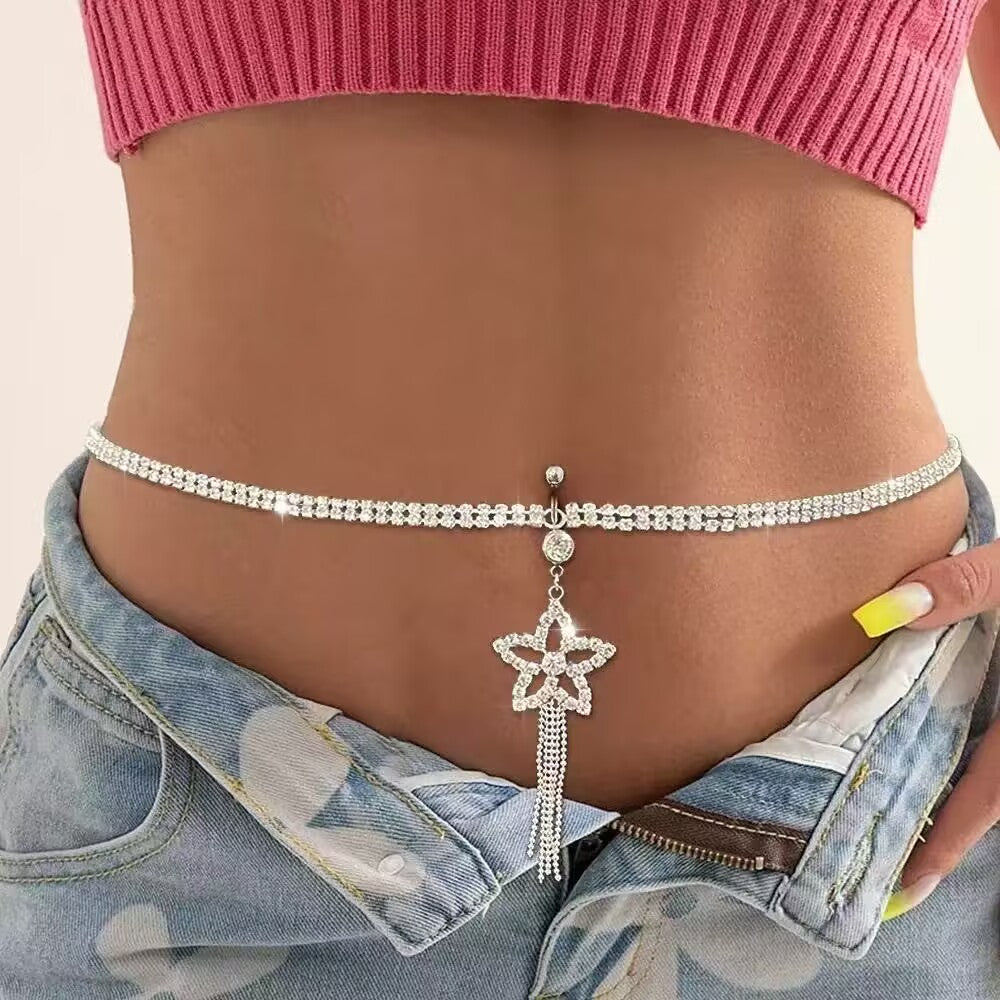 Sparkly crystal flower tassel navel ring with waist chain styled with low rise jeans.