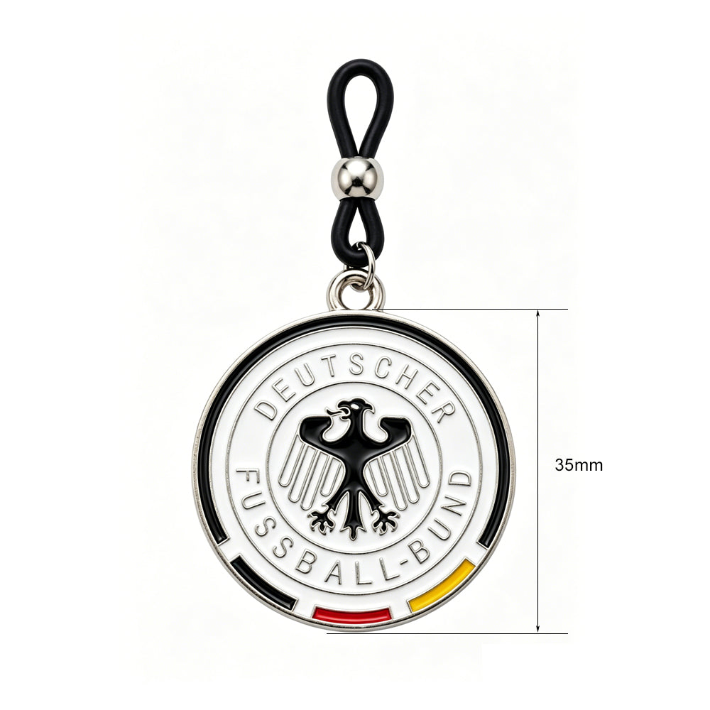 A non-piercing nipple ring featuring a black adjustable silicone loop with a silver slider bead, hanging a 35mm round enamel pendant with the white and black German Football Association (DFB) eagle crest.