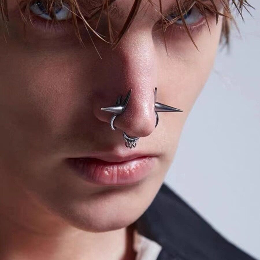 Close-up of non-piercing gothic double nostril ring with metallic spike accents