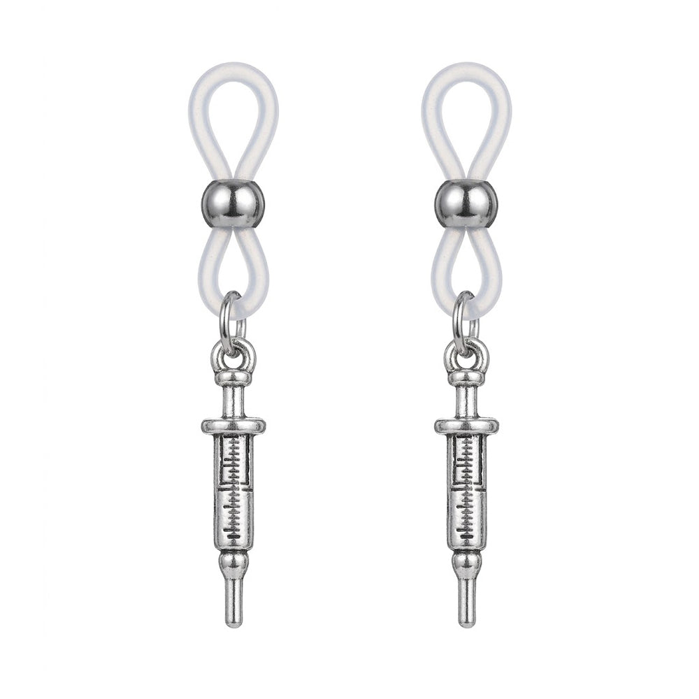 A symmetrical pair of non-pierced syringe nipple clamps featuring clear adjustable silicone loops and vintage silver medical syringe charms, perfectly centered on a clean white background.