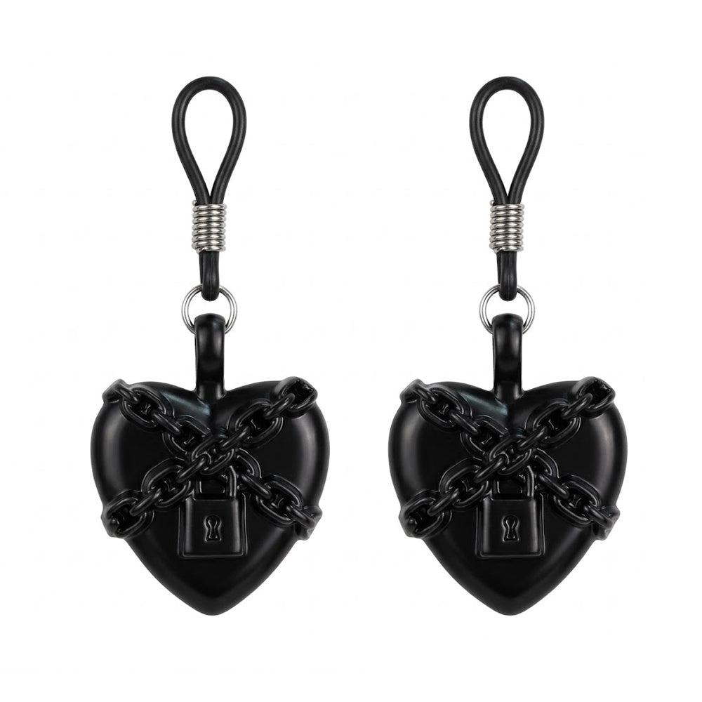 A pair of adjustable gothic heart nipple jewelry with chain detail.