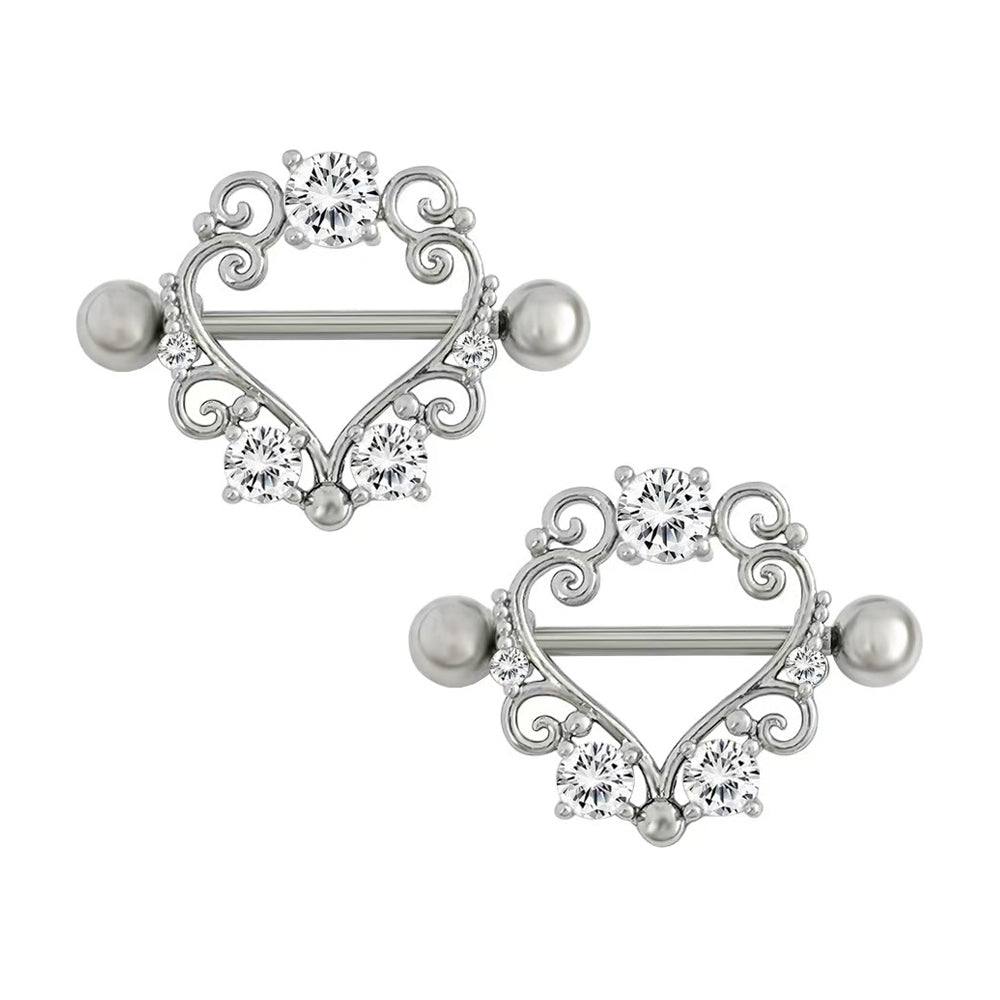 A pair of heart-shaped nipple shield rings with vintage aesthetic for alternative styling.