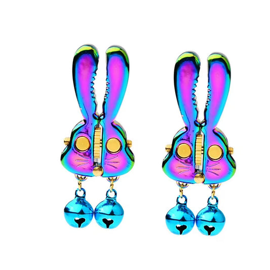A pair of rainbow-colored rabbit nipple clips featuring an adjustable screw mechanism.