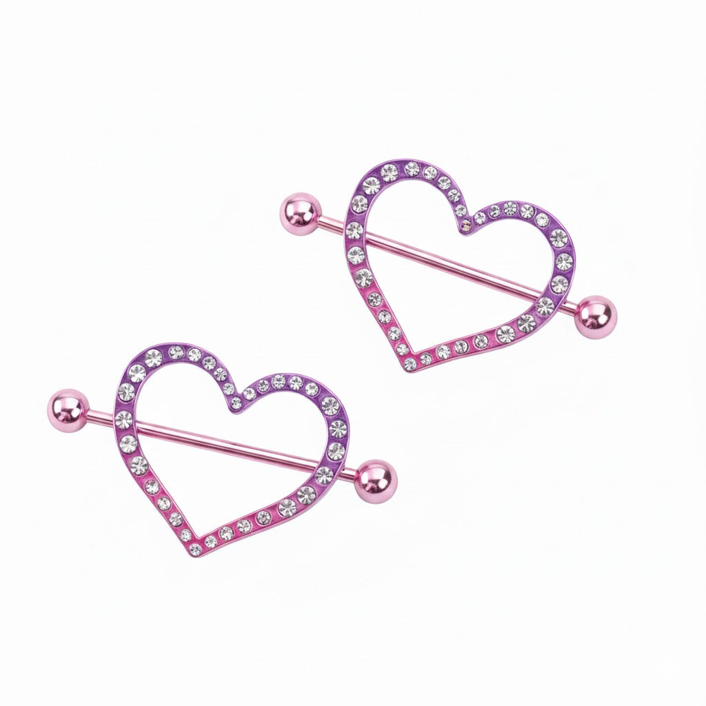 Pair of purple gradient heart-shaped nipple shields with sparkling crystal accents.