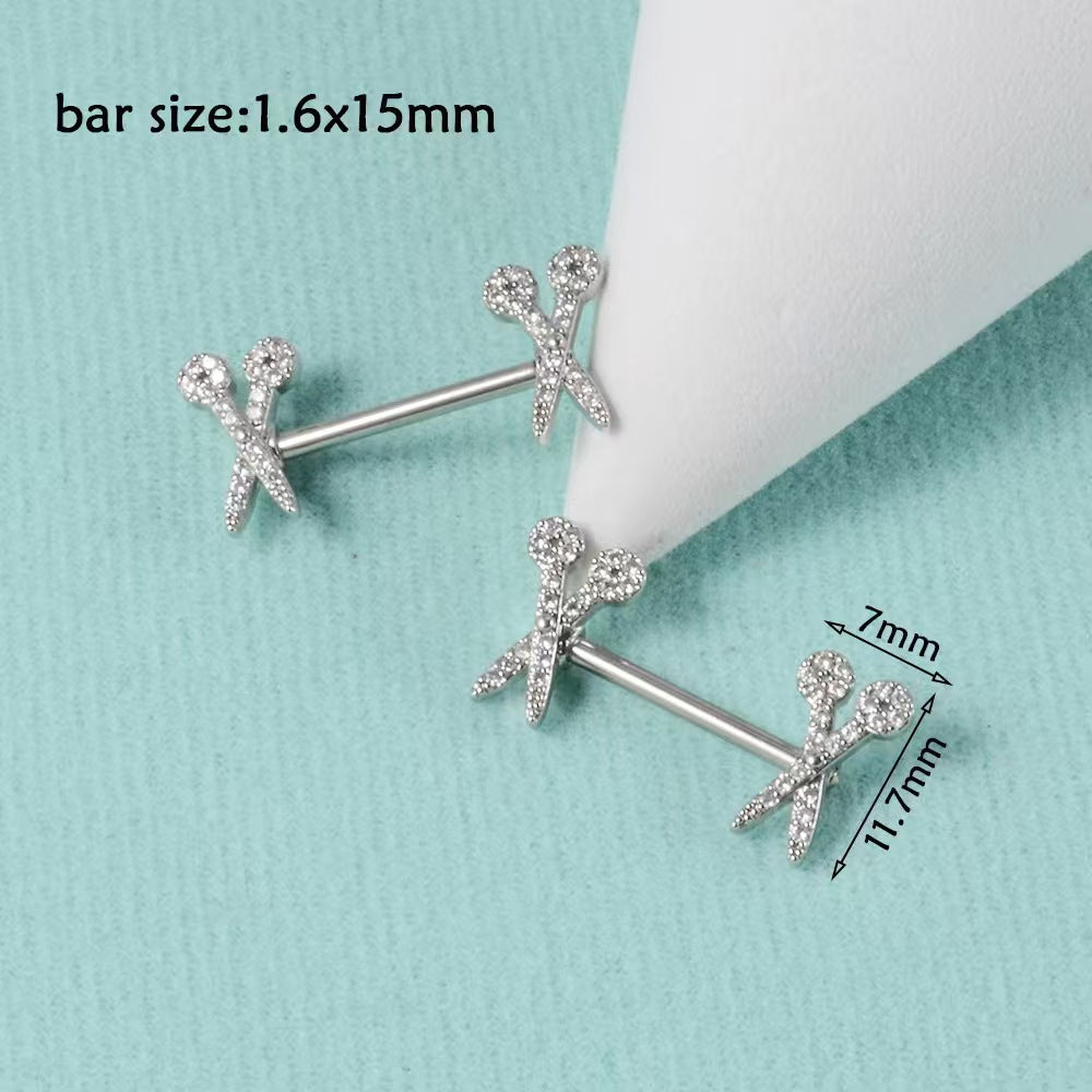 Dimension chart showing 14g 1.6x15mm bar size and 7x11.7mm design end for scissors nipple barbells