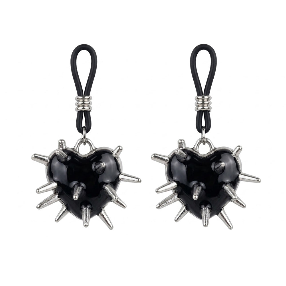 A pair of black heart nipple clamps with silver spikes and adjustable black loops on a white background.