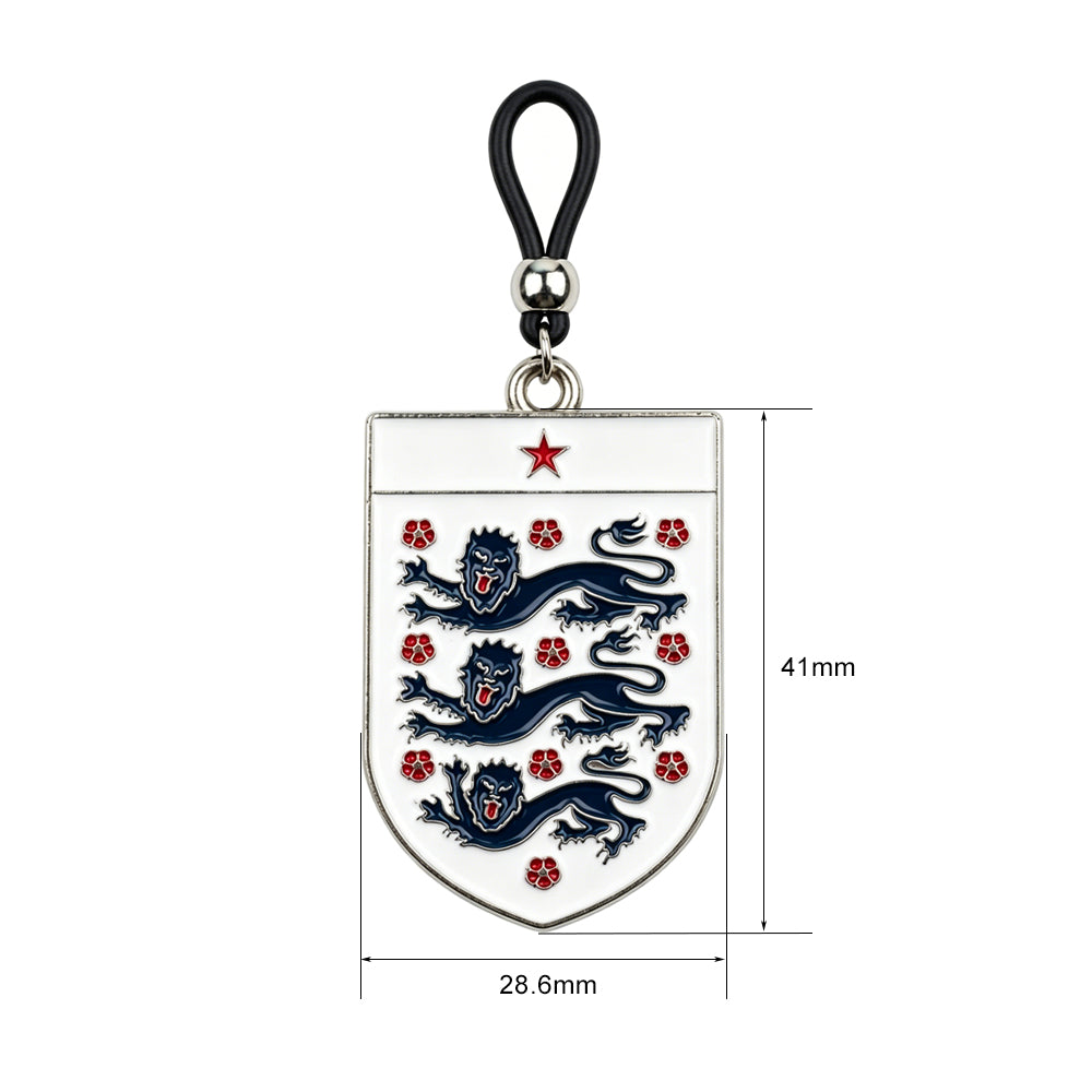 Front view of a white enamel shield nipple clamp featuring the England football Three Lions crest and a red star with an adjustable non-piercing black silicone loop.