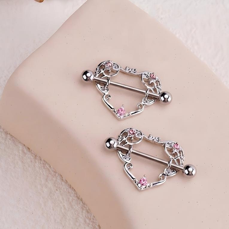 Intricate silver-tone heart-shaped nipple shield jewelry featuring pink rhinestone accents and a straight barbell.-2