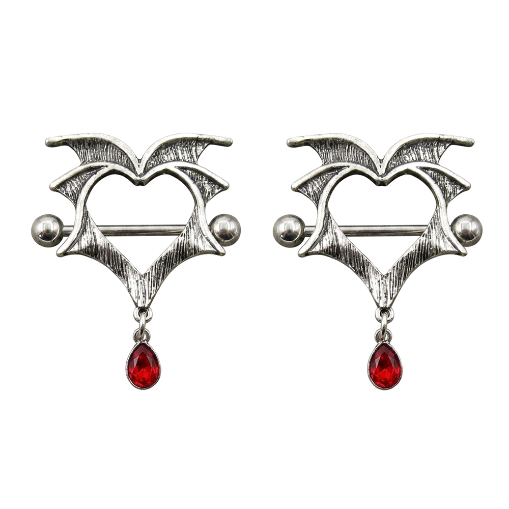 One pair of alternative goth nipple shields featuring 14G implant-grade titanium bars and vintage winged heart shields sold as a set.