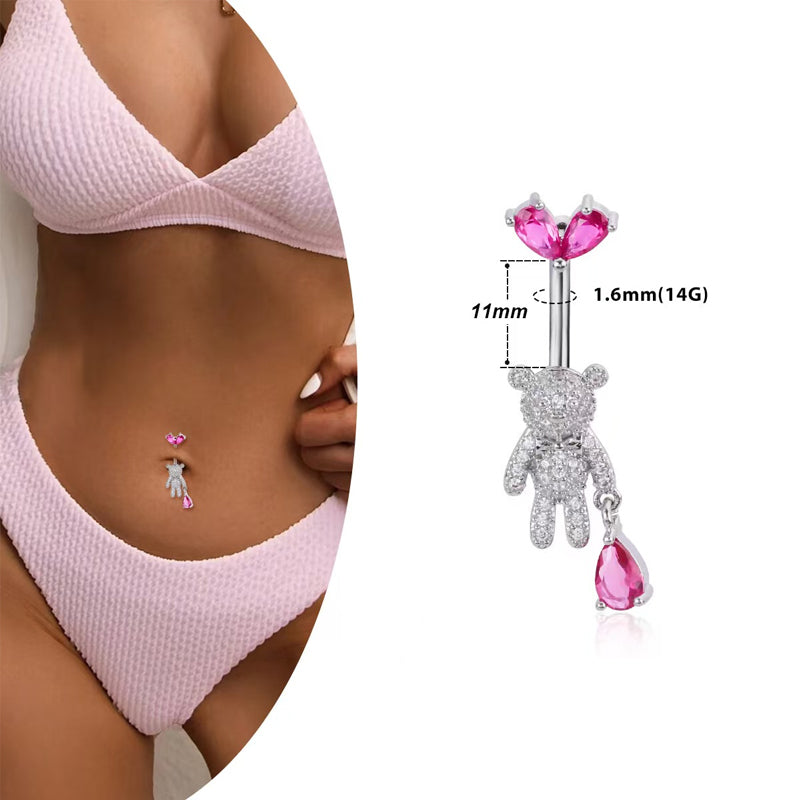 Model wearing a paved teddy bear belly ring with dimensions showing 14G (1.6mm) gauge and 11mm bar length.