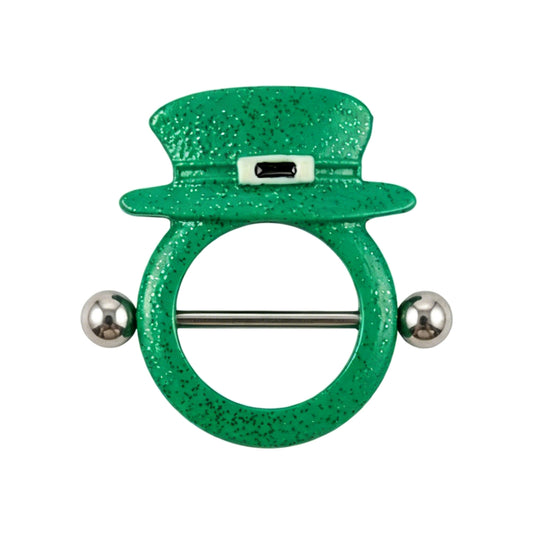 A single 14G F136 titanium nipple shield featuring a vibrant green glitter leprechaun top hat design with a black buckle accent, isolated on a pure white background.