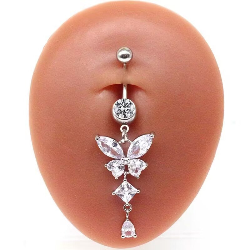 Real wear display of silver CZ butterfly dangle belly button ring on belly model.