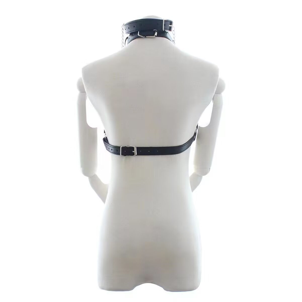 Back view of black leather body harness on mannequin showing adjustable belt buckle strap for tailored fit.