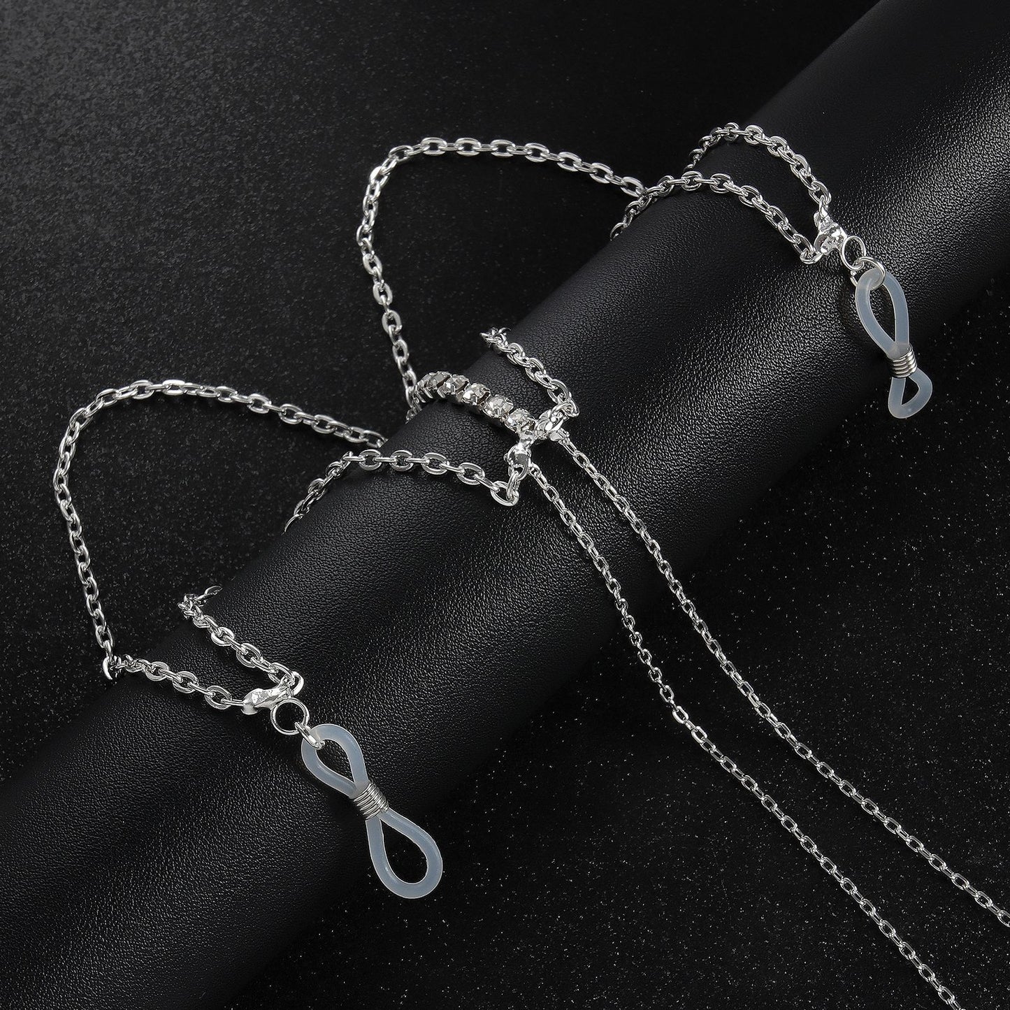 Detailed view of adjustable lobster clasp and clear silicone loops for versatile attachment.