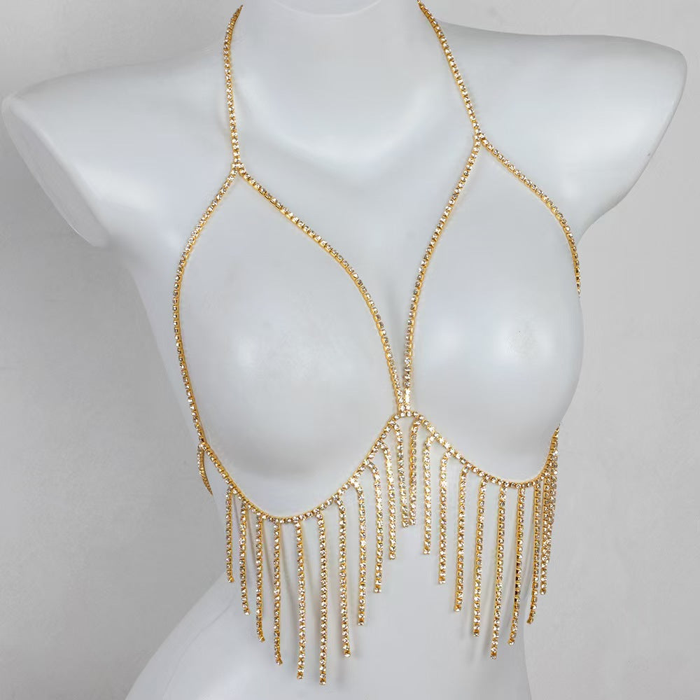 Elegant gold rhinestone halter harness bra chain on a mannequin torso, showcasing the brilliant shimmer of the closely-linked crystal claw chains.