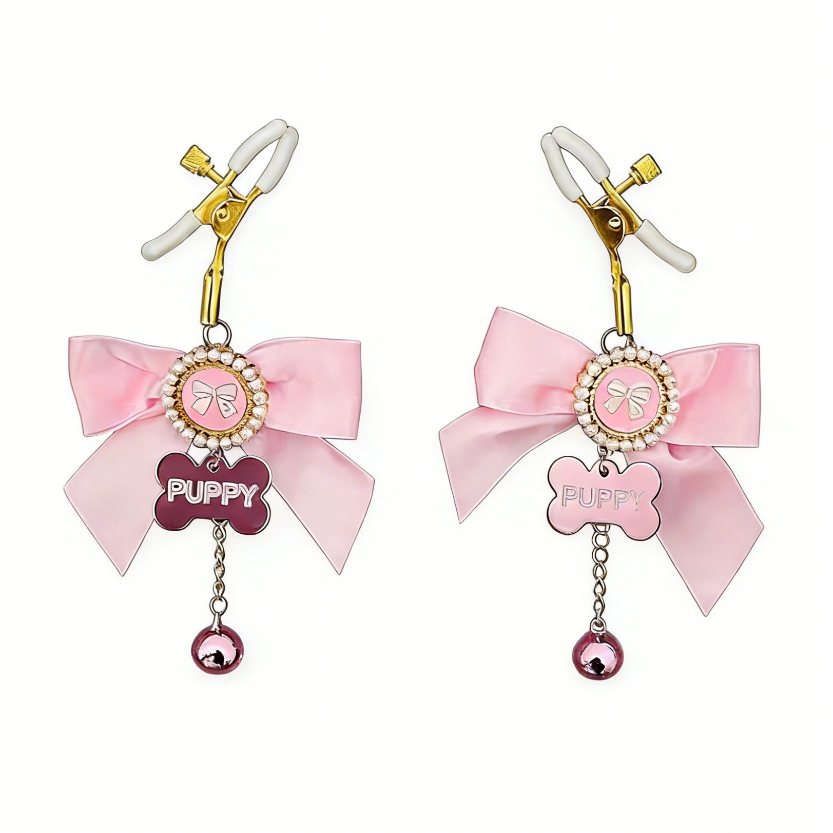 Adjustable gold-toned nipple clamps with white protective soft tips and pink bow charms.