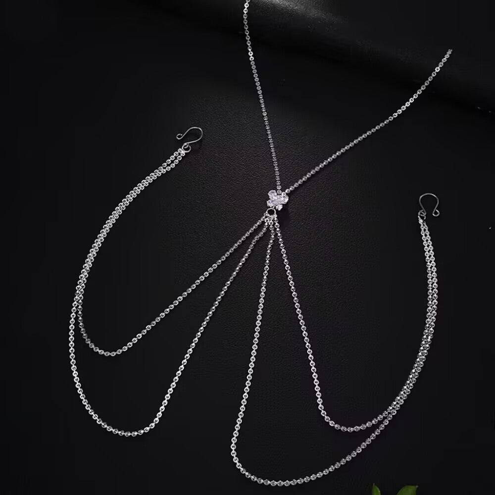 Detailed flat lay of the adjustable U-shaped fake nipple rings connected to a multi-layered silver tassel chest chain with a shiny crystal butterfly.