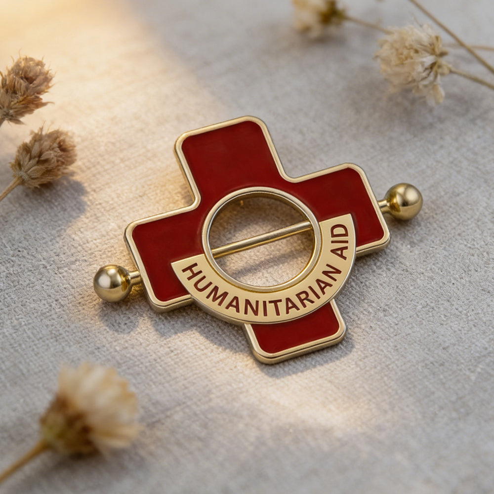 Lifestyle shot of a red cross nipple shield with dried flowers