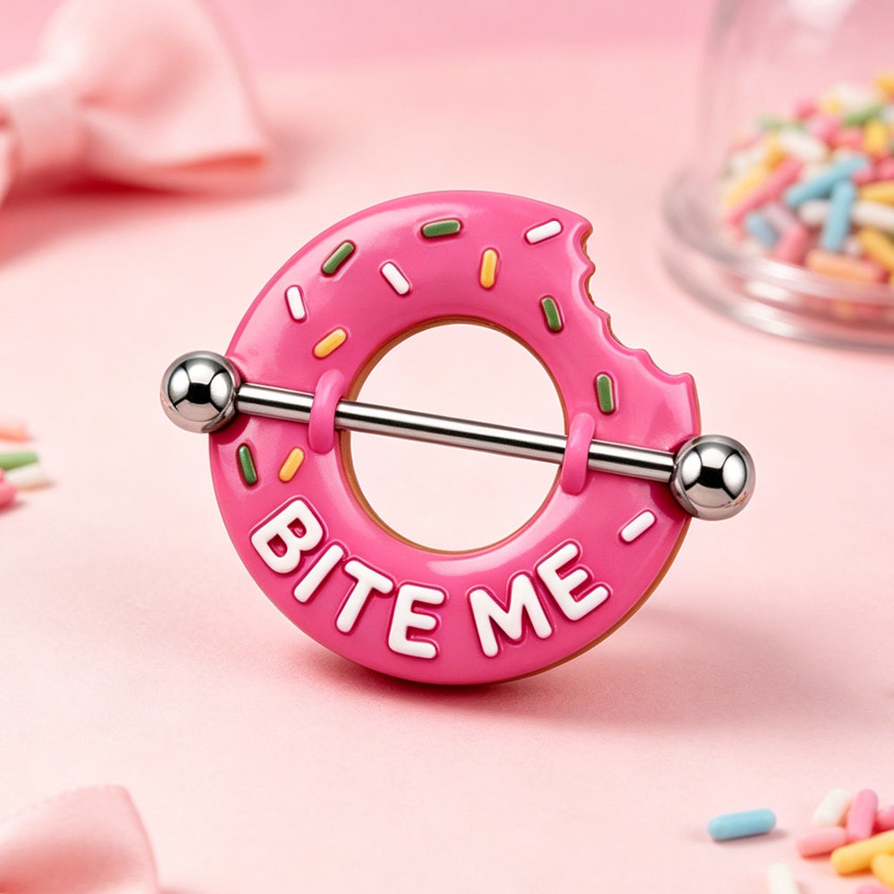 Aesthetic lifestyle shot of the pink donut nipple jewelry surrounded by pink sprinkles and cute decor.