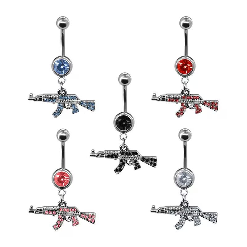 Multi-color AK47 rifle dangle belly button rings in blue, red, black, pink, and clear crystal pave variants on white background.