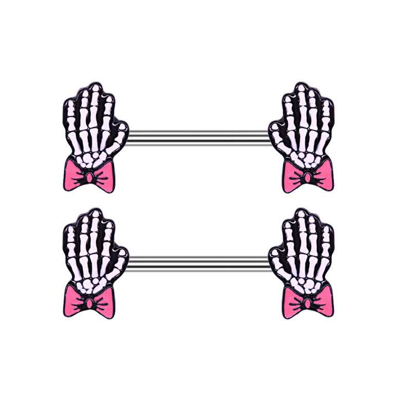 Pair of skeleton hand nipple rings featuring cute pink bows for a creepy-cute look.