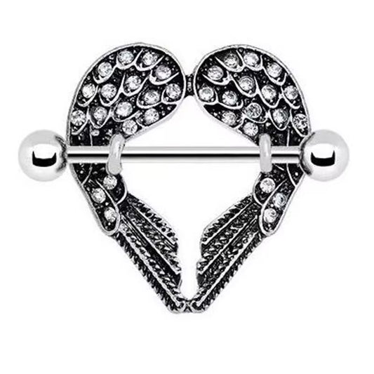 Close-up view of a silver heart-shaped nipple shield featuring crystal-studded angel wings and a straight barbell.