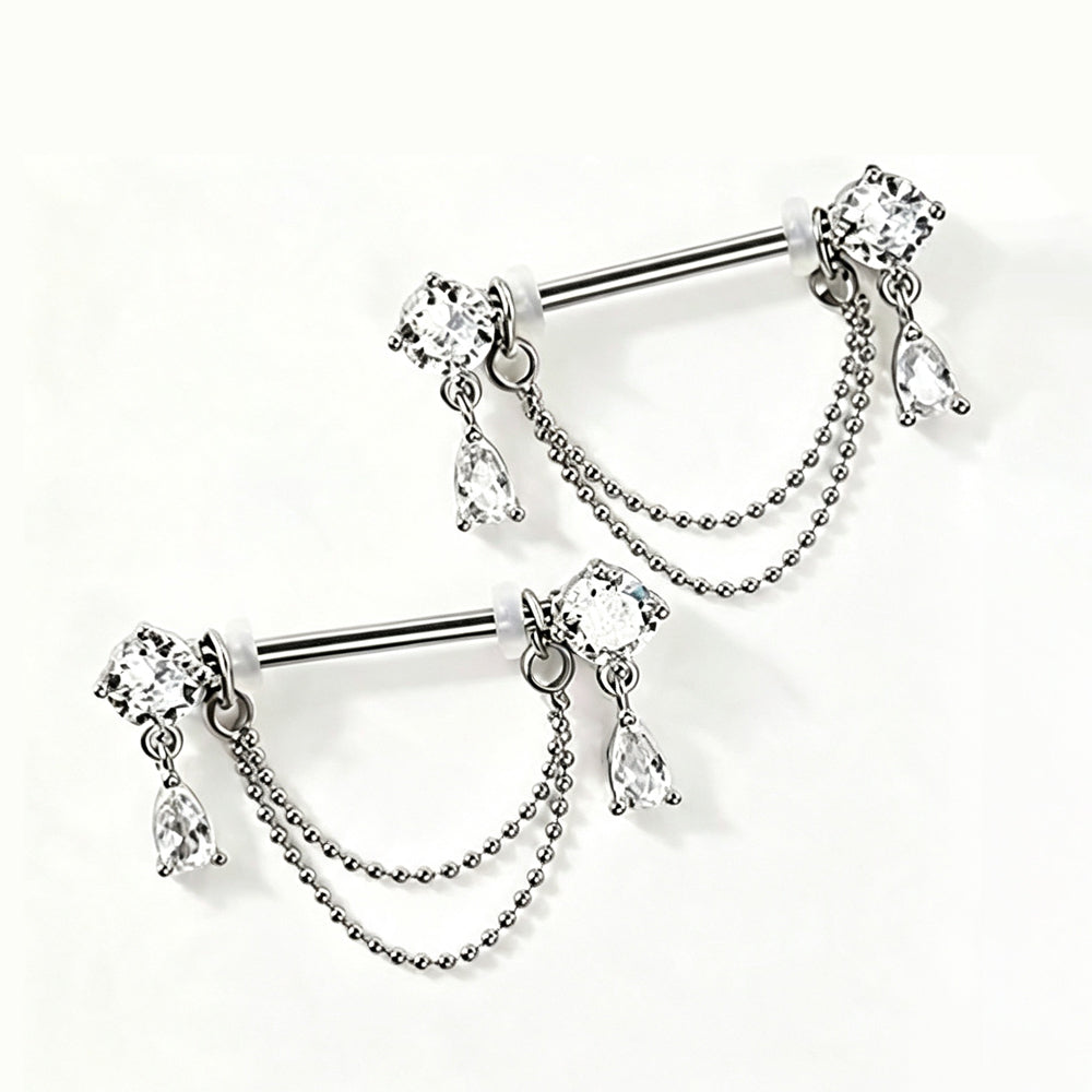 Side angle perspective of two dangle nipple barbells highlighting sparkling teardrop pendants and ball chains