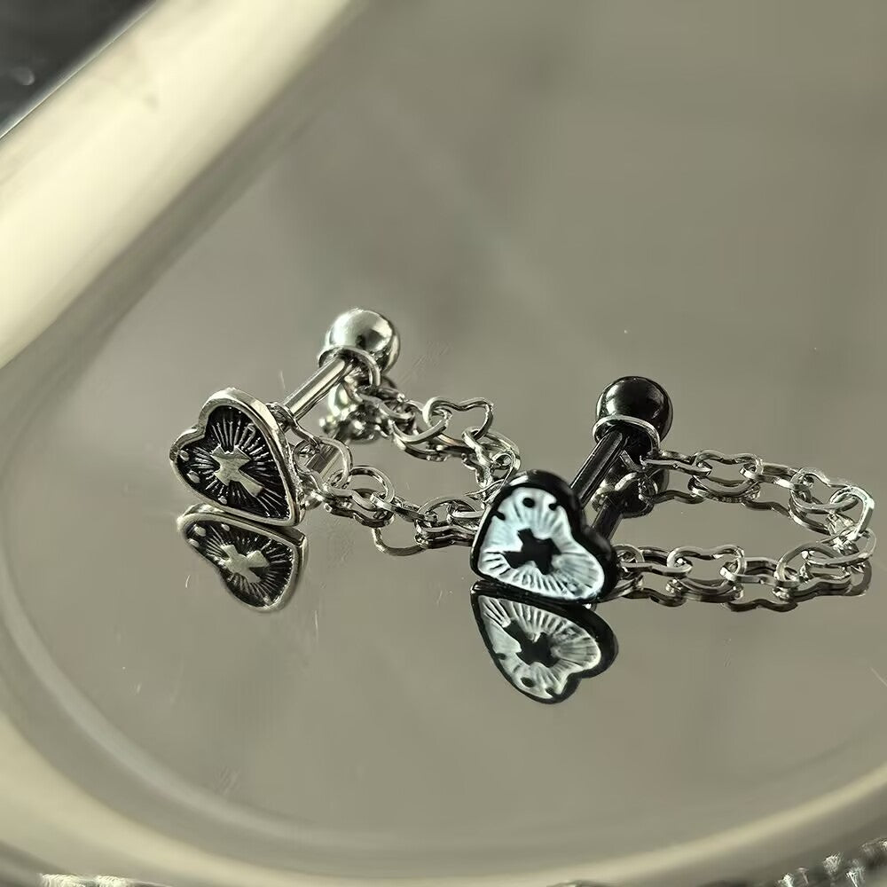Pair of gothic cross heart tongue barbells in antique silver and black finishes with dangling heart chains.