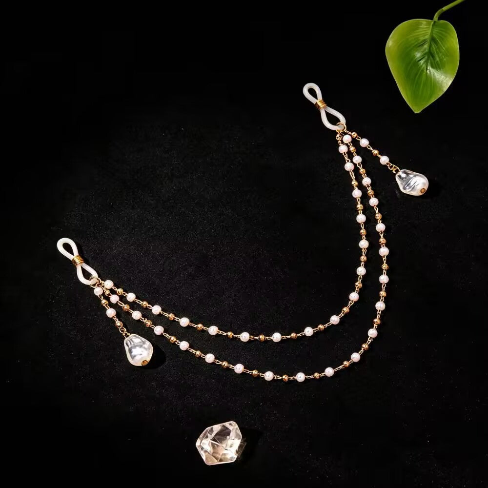 Elegant baroque pearl drop drape nipple clamp body jewelry on dark background