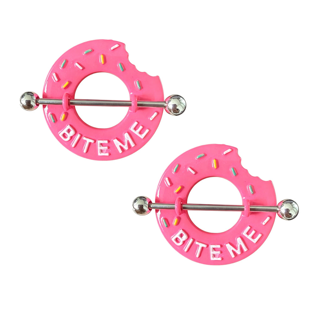 Two matching pieces of the Bite Me pink strawberry donut nipple piercing shields sold as a pair on a white background.
