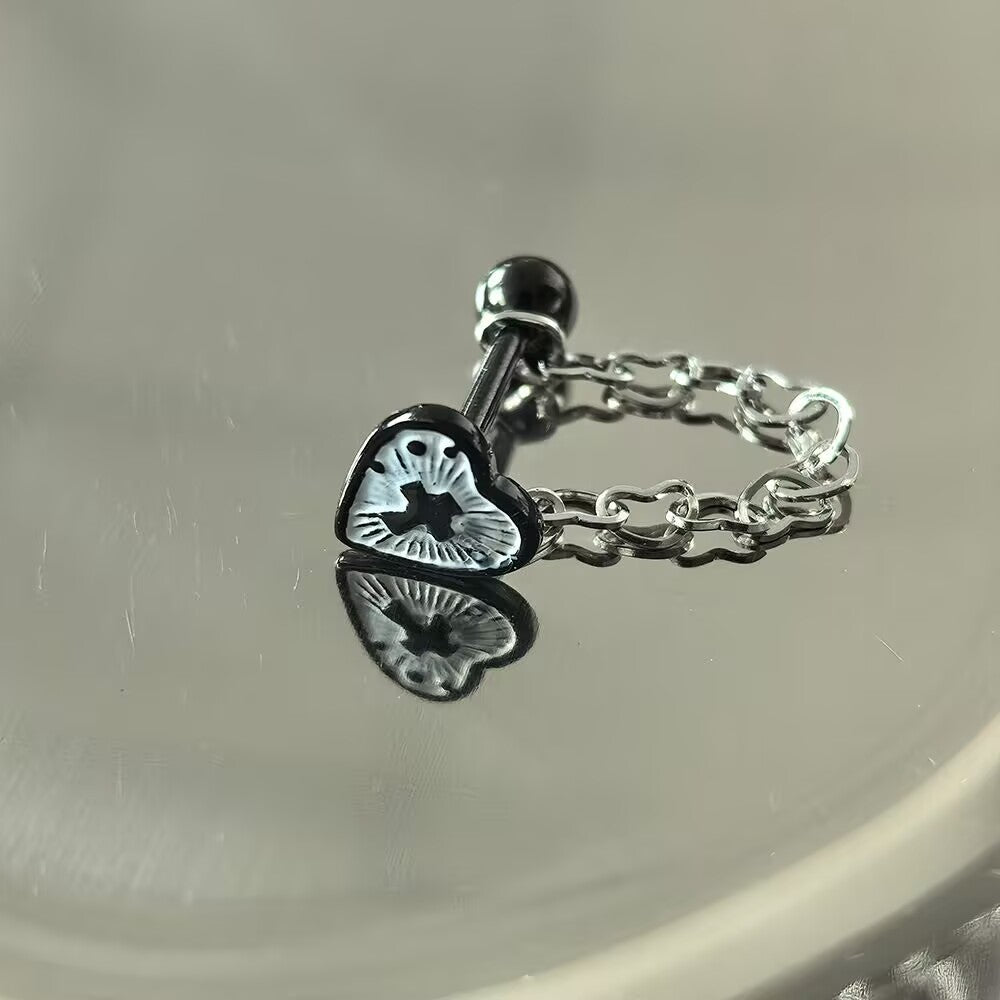 Black enamel cross heart tongue piercing barbell showcasing a dark aesthetic dangle heart chain.