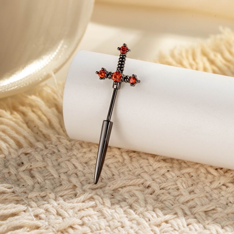 Edgy black plated gothic dagger sword earring with dark red crimson zircon crystals.