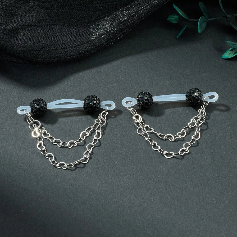Pair of black sparkling-ball non-piercing nipple jewelry with translucent loops and double heart chains