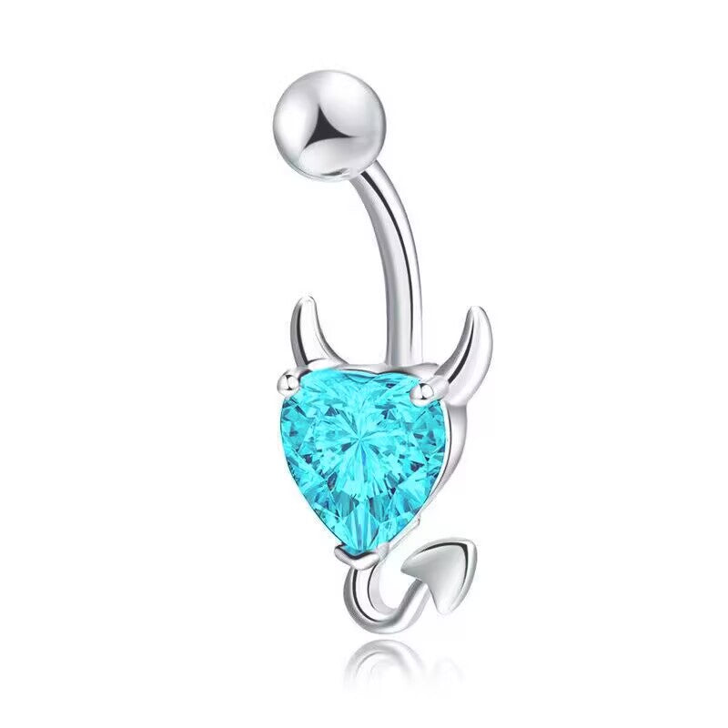 An ocean blue crystal cubic zirconia devil heart navel piercing ring for festival and summer swimwear outfits.