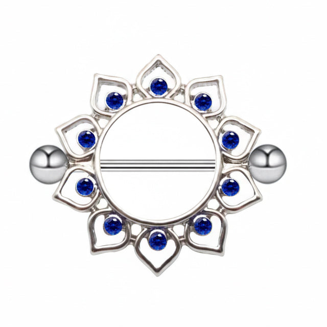 Close-up of a bohemian lotus style nipple shield featuring vibrant blue gemstones.