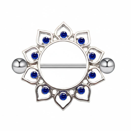 Close-up of a bohemian lotus style nipple shield featuring vibrant blue gemstones.