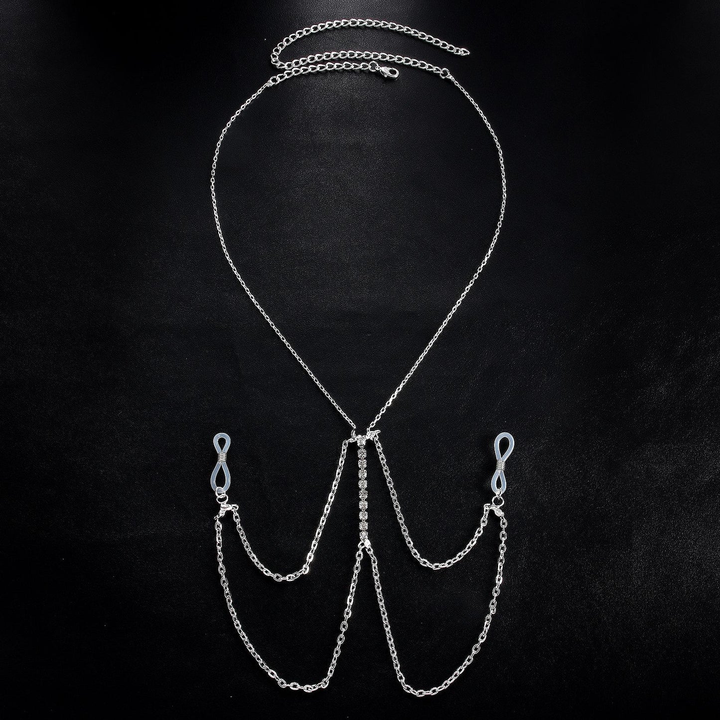 Exquisite multilayer tassel body chain with crystal centerpiece displayed on a black background.