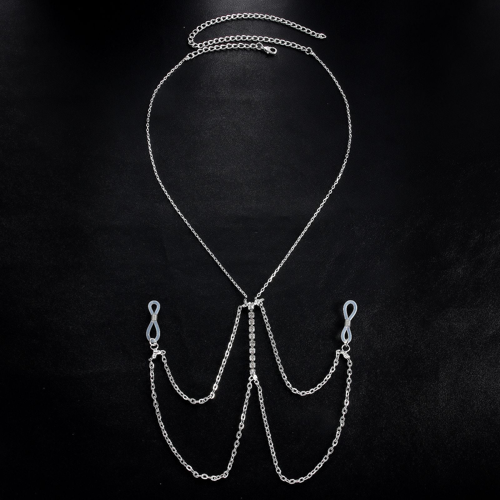 Exquisite multilayer tassel body chain with crystal centerpiece displayed on a black background.