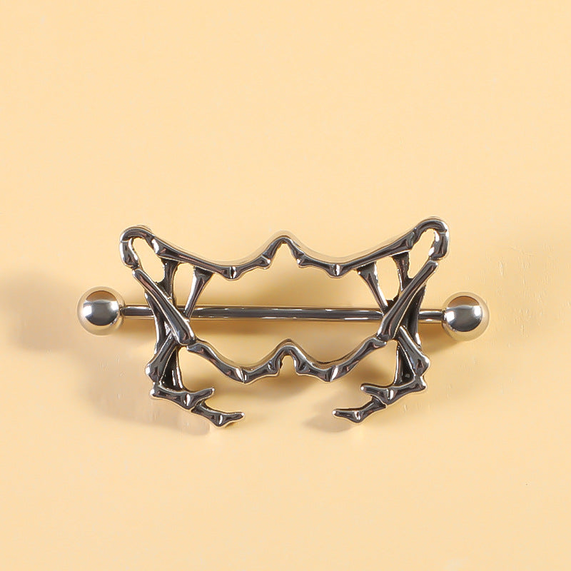 Intricate gothic anatomical bone design nipple shield for alternative fashion.