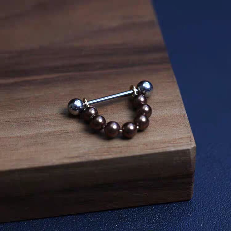 Compact bronze brown pearl shield nipple piercing barbell without dangle.