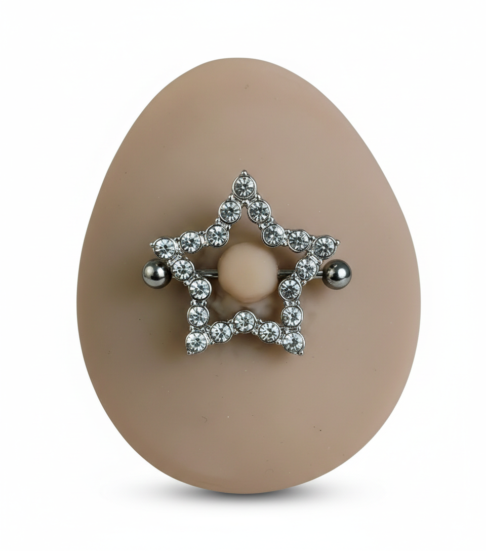 Visual demonstration of the celestial star nipple shield jewelry on a silicone model for size and aesthetic reference.