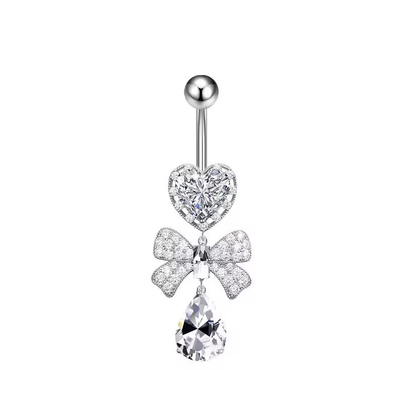 Clear crystal heart and bowknot dangle navel piercing jewelry on a white background.
