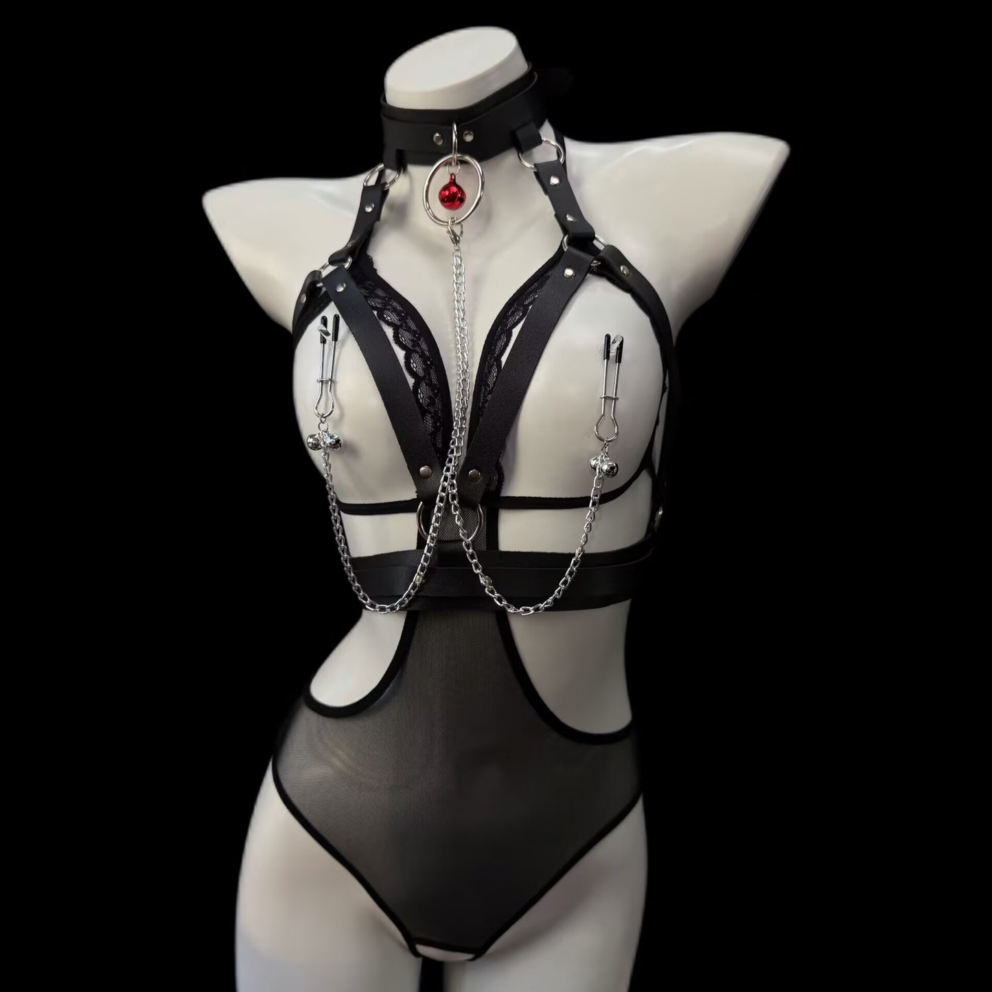 Front view of black leather body harness with tension clip non-pierced nipple chains